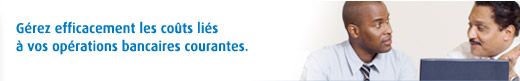 Image de deux personnes qui se parlent devant un écran d'ordinateur