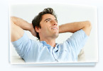 Photo of a man lying on his back looking at the sky