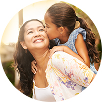 Mother and daughter smiling