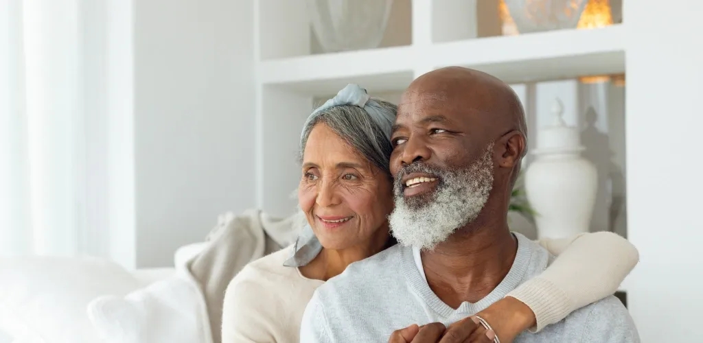 Elderly couple sitting together