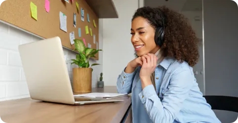 A woman makes a credit card payment online to build her credit rating