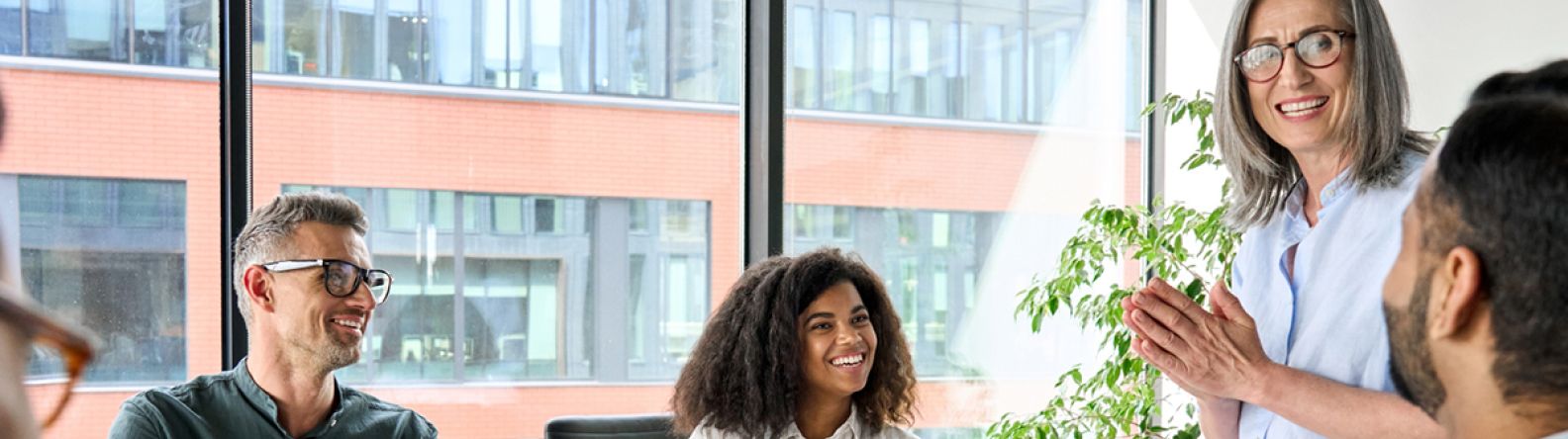 A happy group of people in a meeting room