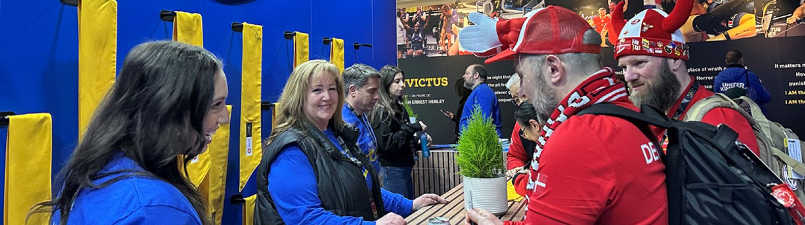 Team BMO working at a counter at the Invictus Games