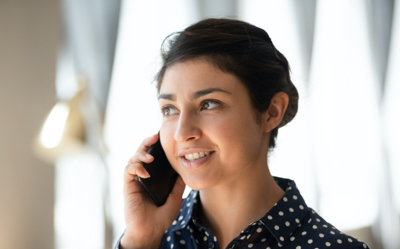 A woman calling her bank to report unusual activity on her account