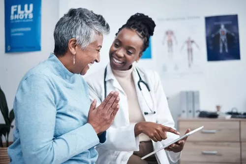 A patient and doctor looking over results